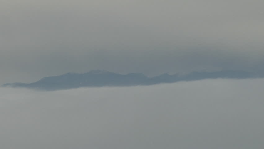 Wavy Fog Top. Gravity waves move along top of layer of valley fog