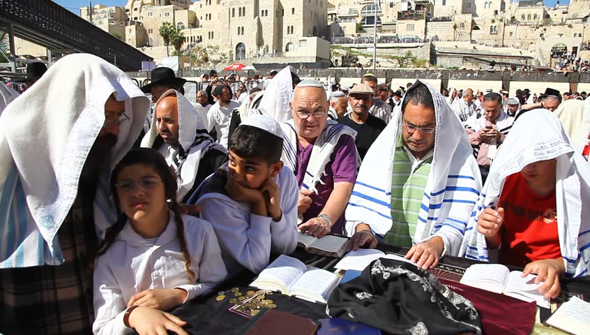 JERUSALEM, ISRAEL -  MARCH 28: Thousands of Jews practice the Priestly Blessing  (Hebrew - Birkat Cohanim) at the Western Wall plaza during the Passover Holiday, March 28 2013 in Jerusalem, Israel.