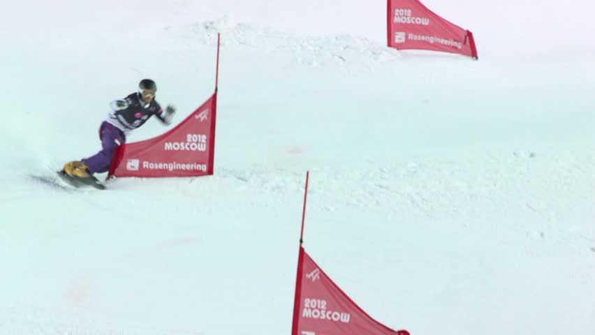 MOSCOW - MAR 3: Snowboarder slaloming while descending at 18th stage of World Cup on snowboard 2011/2012, in sports complex Luzhniki, on Mar 3, 2012 in Moscow, Russia