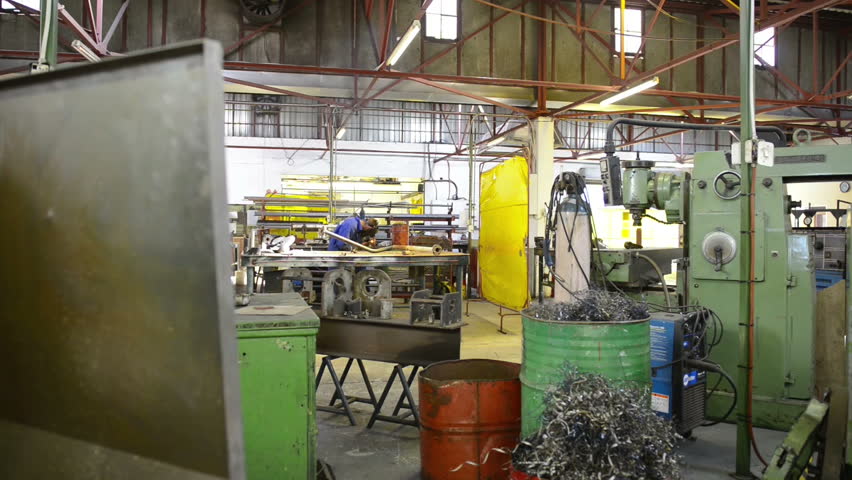 An industrial service repairmen labouring in workshop
