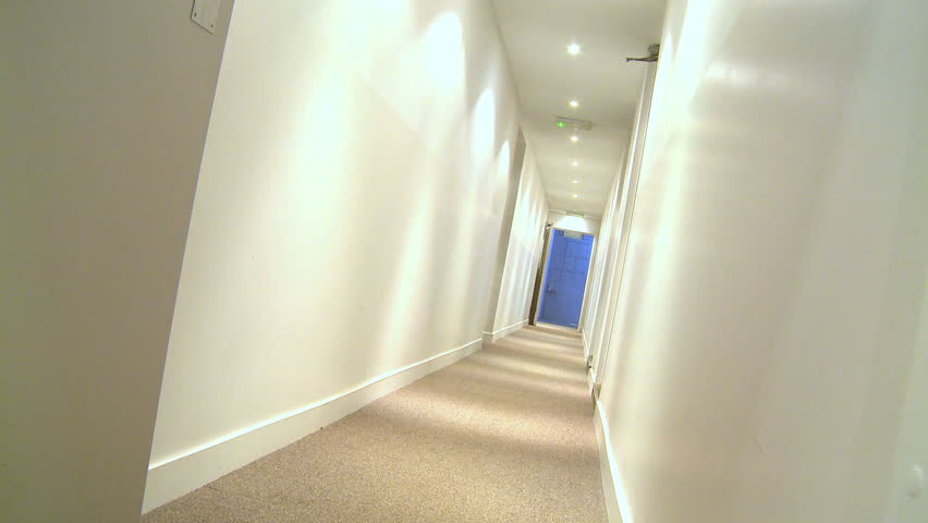 Agitated young businessman trying to escape the workplace