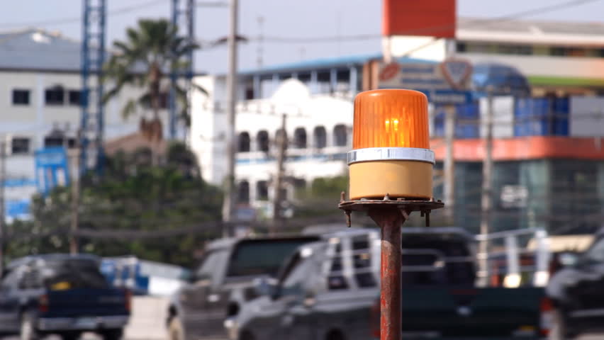 Yellow twisting flasher on Thailand's road
