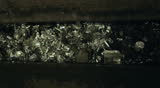 Scrap metal moving into the container. Preparation for iron melting
