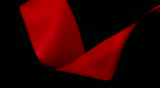 Red cloth fabric blowing into the scene and out.  Video has a luma matte included
