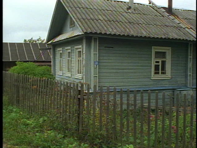 Russia, Peasant Village, gray house, medium shot, tilt up