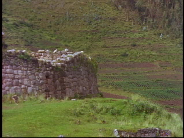 Peru, The Andes, Inca ruins on hillside, close up, zoom out wide