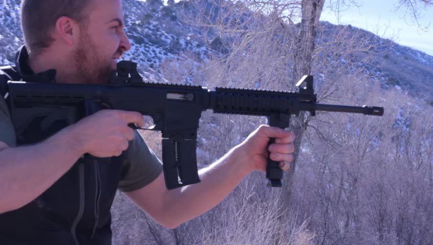 An black AR-15 Assault rifle, a semi-automatic weapon