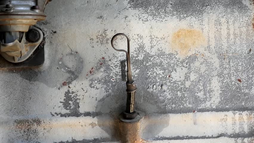 Side View Of Old Diesel Engine Oil Dipstick Removed And Replaced