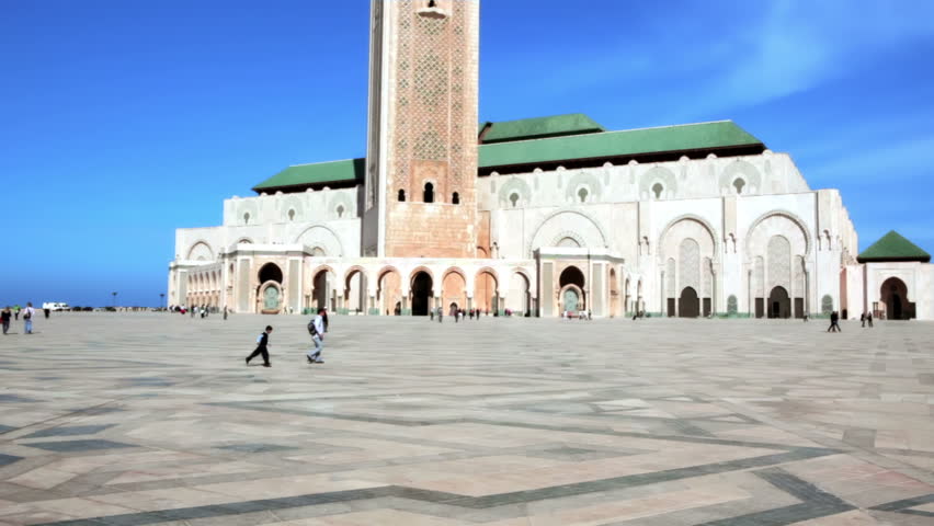 CASABLANCA, MOROCCO - OCT 16: Prayers and tourists sightseeing the exterior of the Mosque Hassan II on October 16, 2010 in Casablanca, Morocco. 