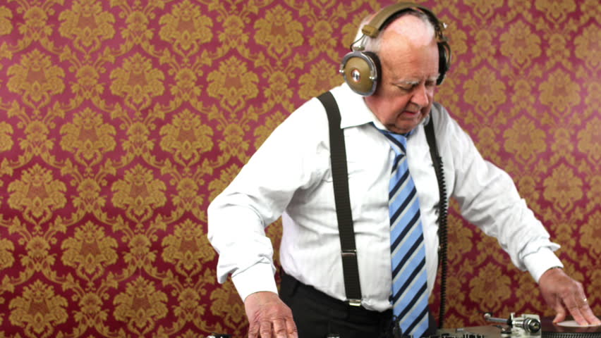 a very funky elderly grandpa dj mixing records
