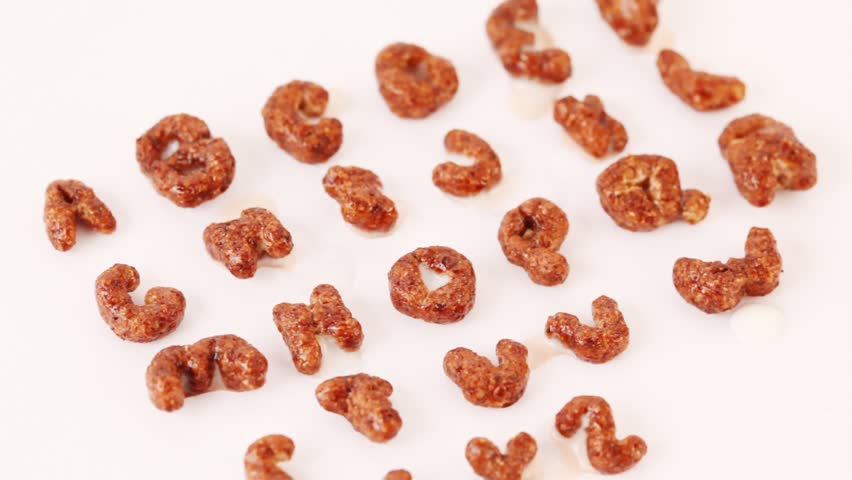 Alphabet letters from cereals on white background, close up