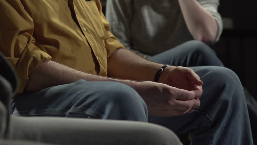 Man talking about his struggles to group