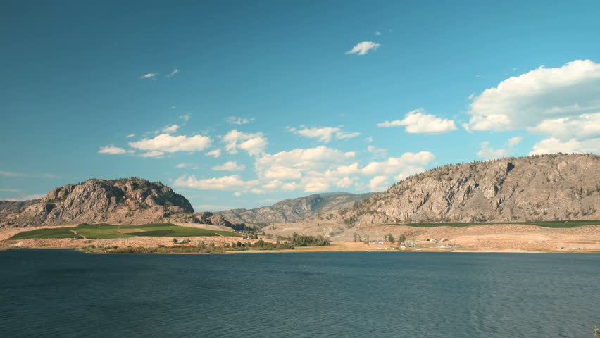 Osoyoos Lake Timelapse, British Columbia. Timelapse view of Osoyoos Lake and the hills and vineyards in the Southern Okanagan Valley. British Columbia, Canada.
