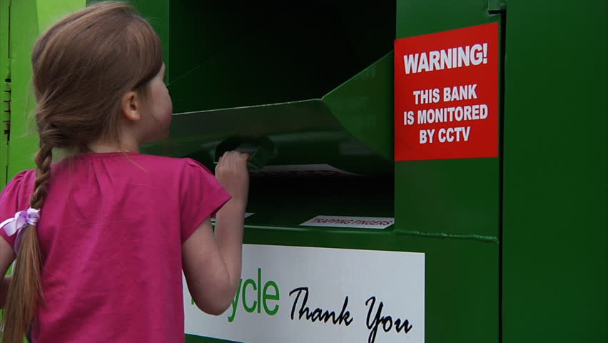 Child recycling - little girl recycles some boots