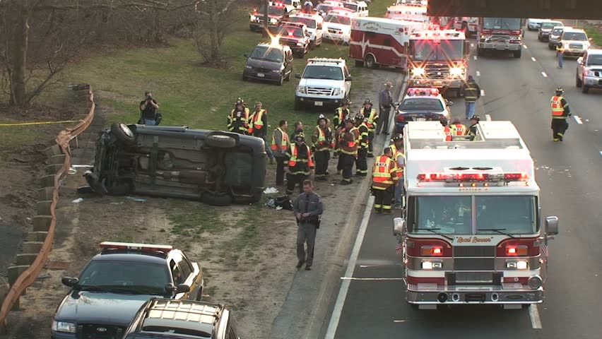 April 5, 2009 - Long Island, NY - Overturned Car Accident Scene on Highway with Fire Trucks and Police