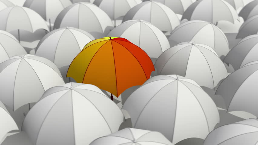 One colored umbrella among set of white umbrellas