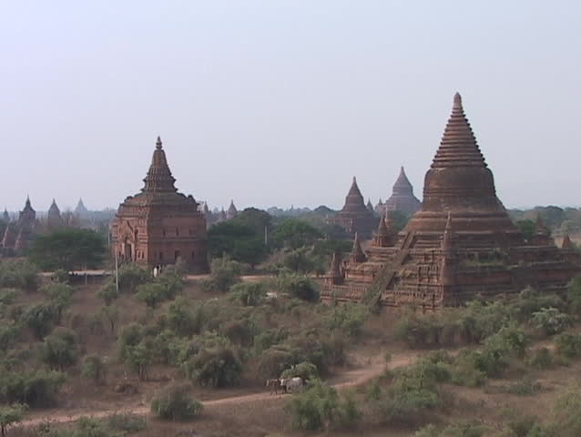 burma scenes: various temples of ancient city of pagan with ox cart