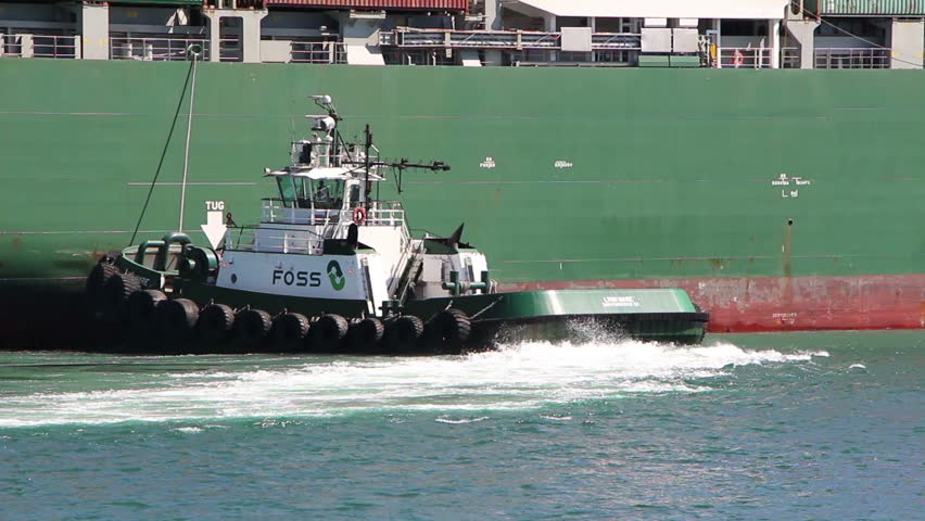 LOS ANGELES - NOV 2: Tugboat - FOSS Lynn Marie - Assists Container Ship For Mooring in Los Angeles on November 2, 2012