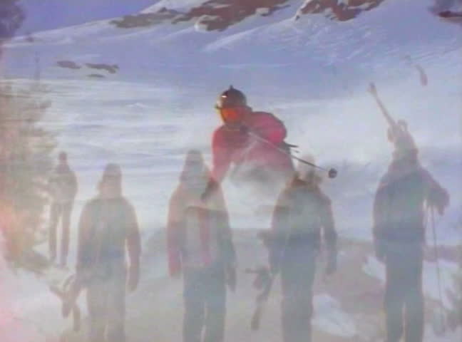 Video montage of competition between snowboarder and skier. Skiing and low angle skiing points of view of them going down a snowy slope or doing high jumps. 