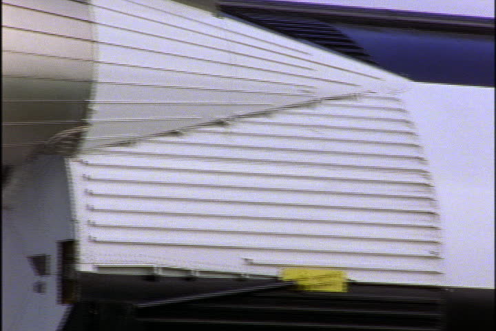 JOHNSON SPACE CENTER, HOUSTON, TEXAS - APRIL 28,1999: Mid section of retired Saturn rocket, painted with American flag and USA.""