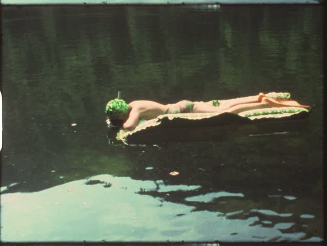 Vintage 8mm film: Girl in pond