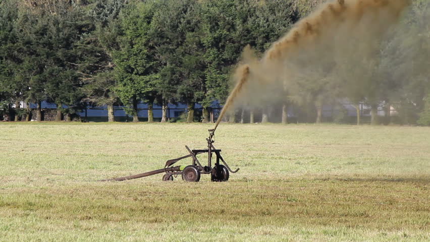 Cattle and swine manure is spread onto agricultural land, providing nutrients for better productivity/Spreading Cattle and Swine Manure/Manure is spread onto agricultural land.