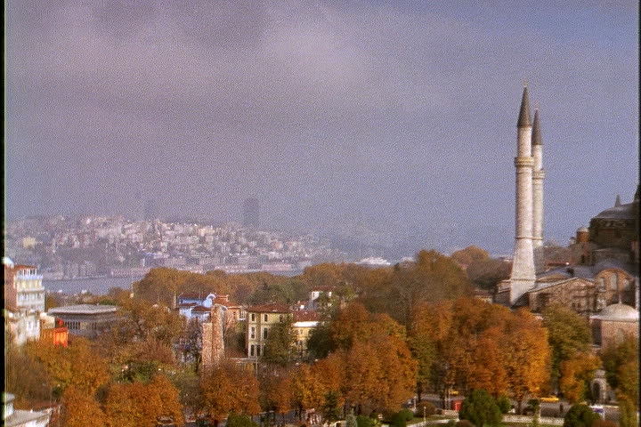 ISTANBUL - CIRCA NOVEMBER 1999: Pan over fall foliage and minarets to Hagia Sophia.