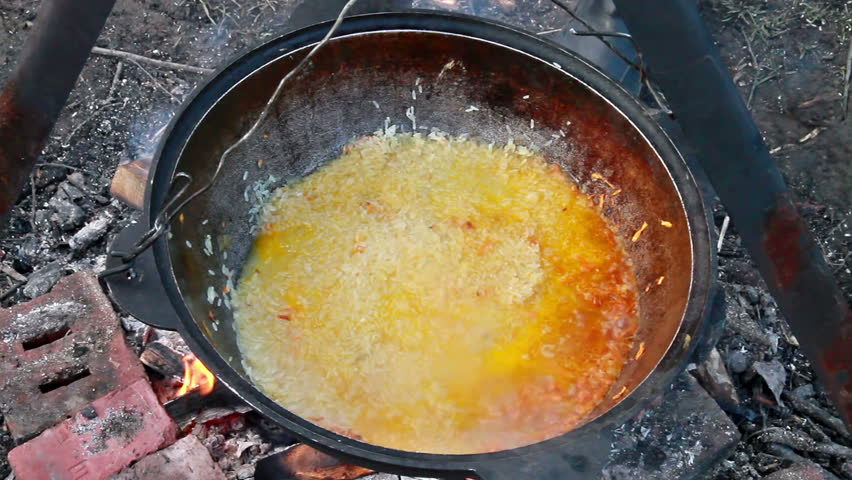 Cooking pilaf. Add the water