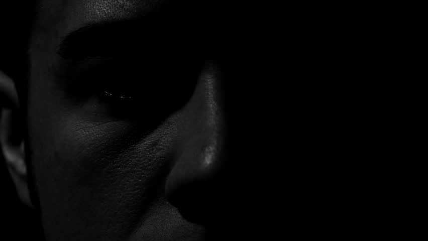 Man's eyes in black and white. Experimental lighting. 