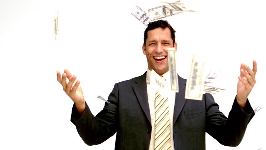 Businessman joyfully throwing his money in slow motion