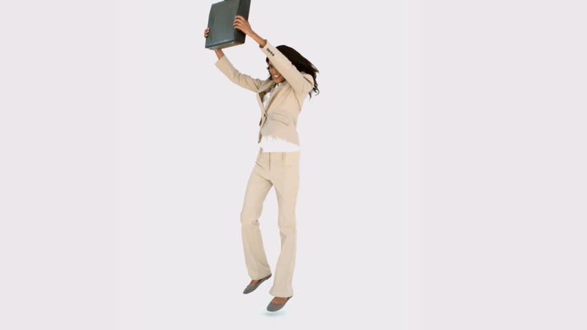 Businesswoman jumping and holding her suitcase in suitcase
