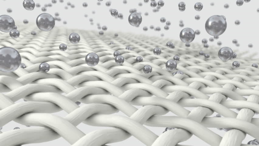 An extreme closeup zoom of fabric being penetrated by silver molecules and emanating spherical green lights on an isolated background