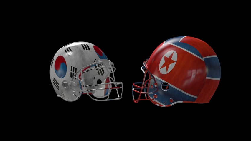 two football helmets collide