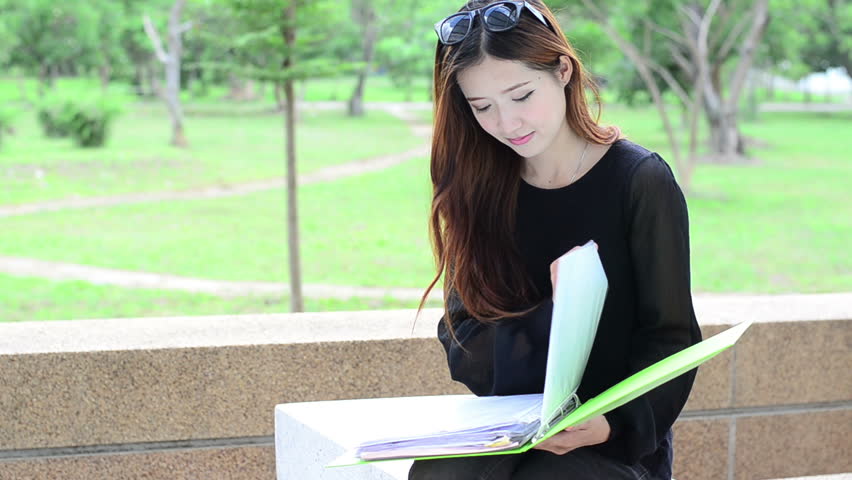 Asian women student looking profile in university and smiling face