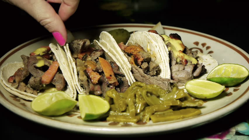 Taking Mexican Arrachera Beef Tacos 