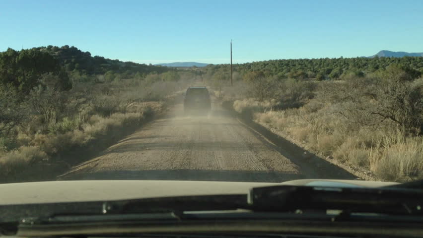 Point of View, day country side, dirt road driving.