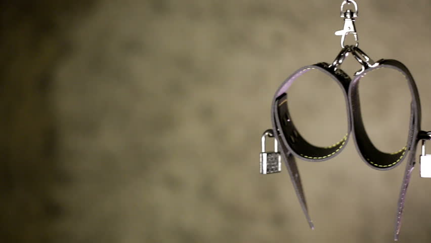 BDSM or dominance and submission for short bondage cuffs for restricting persons freedom, doing with it whatever the dominant partner wants. Quality leather cuffs with locks.