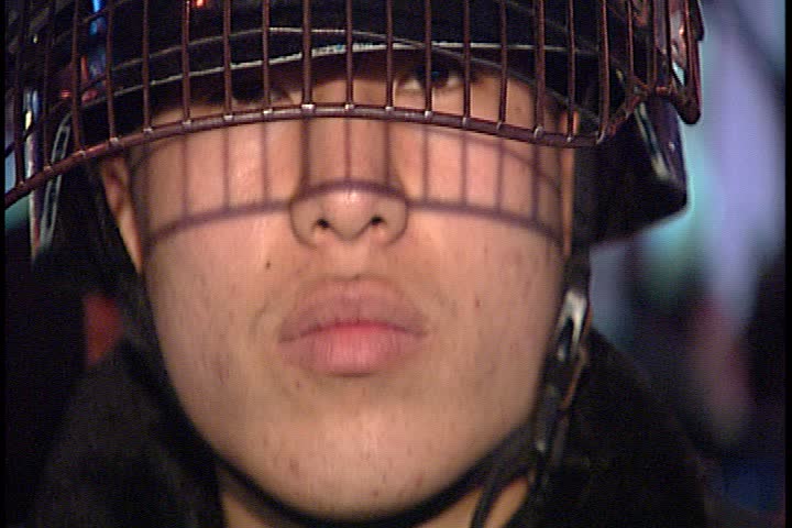 SEOUL - MARCH 02, 2003: Night time peaceful anti-war demonstration in Jung-gu; CU policeman in riot gear.