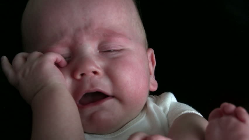 Baby crying and seeming very upset.  HD 1080i