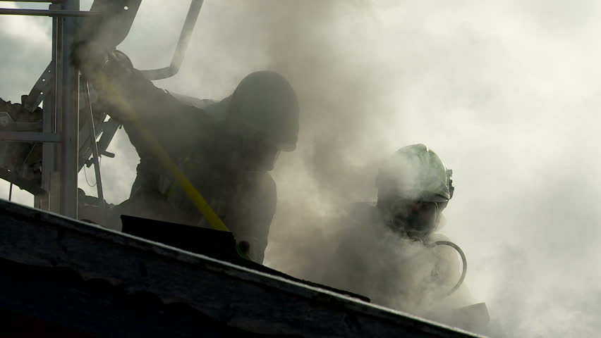 SouthTyrol, ITALY - CIRCA 2012: Fire brigade extinguish fire, garden house burns.