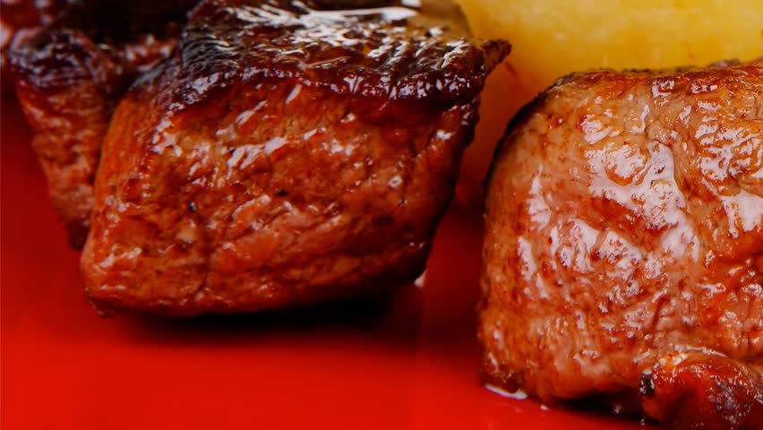 european food: roast beef meat goulash over red plate with tomatoes and dill and bbq sauce 1920x1080 intro motion slow hidef hd