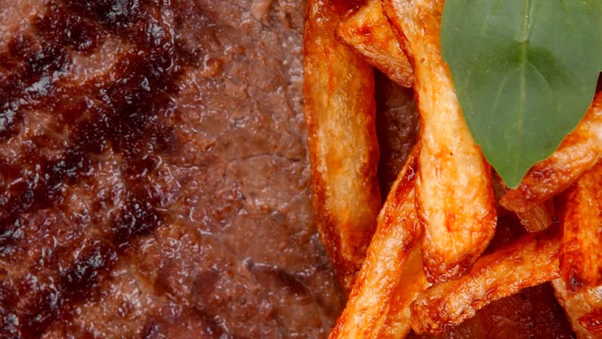meat food : big grill beef steak on dark plate with red hot chili pepper and raw cherry tomato 1920x1080 intro motion slow hidef hd