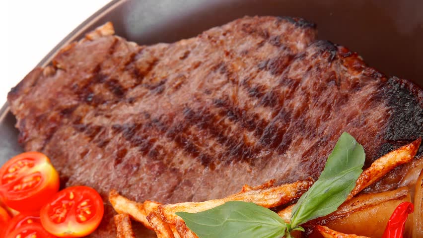 main course : grill beef steak with potato chips and fresh cherry tomato red hot chili peppers on plate 1920x1080 intro motion slow hidef hd