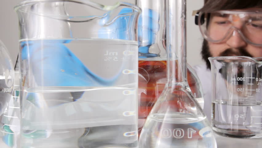 Scientist pouring biofuel in a lab