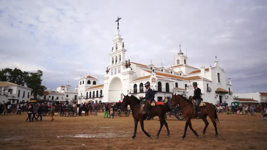 El ROCIO, ANDALUCIA, SPAIN - MAY 19: Pilgrims, people attend to the Sanctuario de Nuestra Senora de El Rocio in one of the most famous religious pilgrimage of Spain. May 19, 2013 in el Rocio, Spain