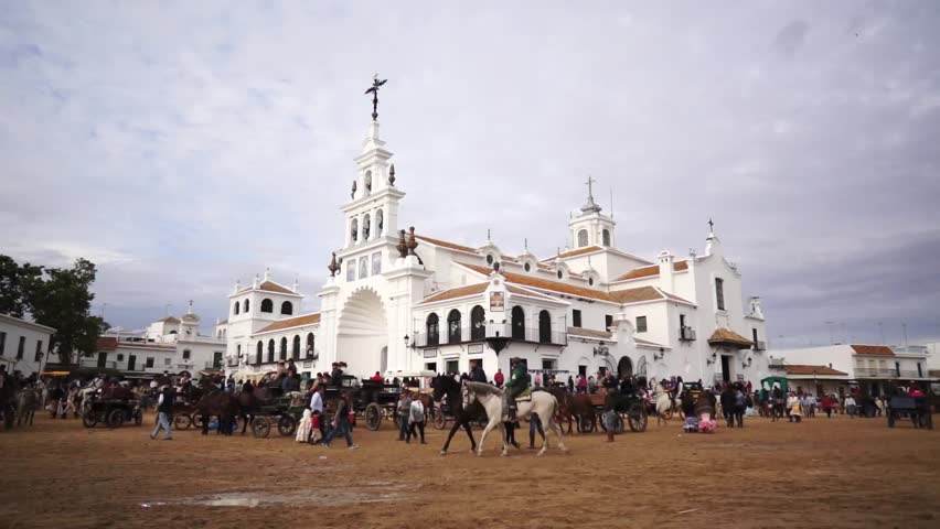 El ROCIO, ANDALUCIA, SPAIN - MAY 19: Pilgrims, people attend to the Sanctuario de Nuestra Senora de El Rocio in one of the most famous religious pilgrimage of Spain. May 19, 2013 in el Rocio, Spain