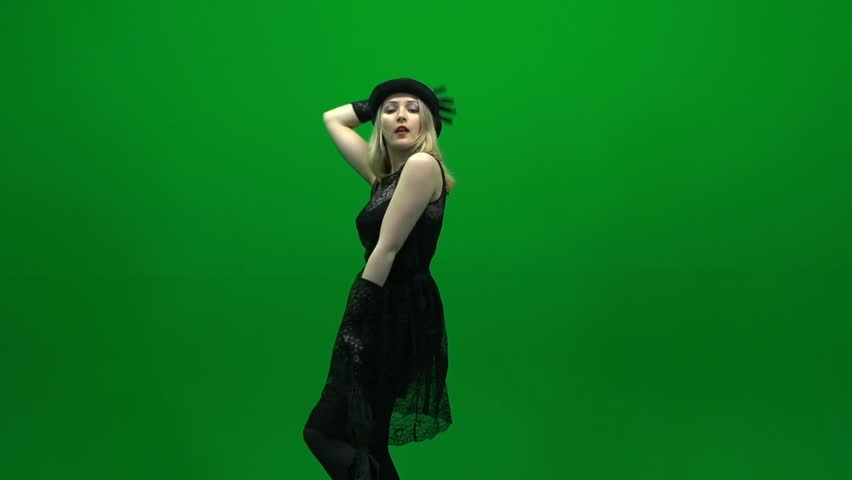 dancing women with umbrella isolated against green screen