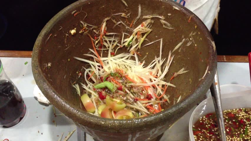Cooking green papaya salad Thai cuisine spicy " SOM TAM "