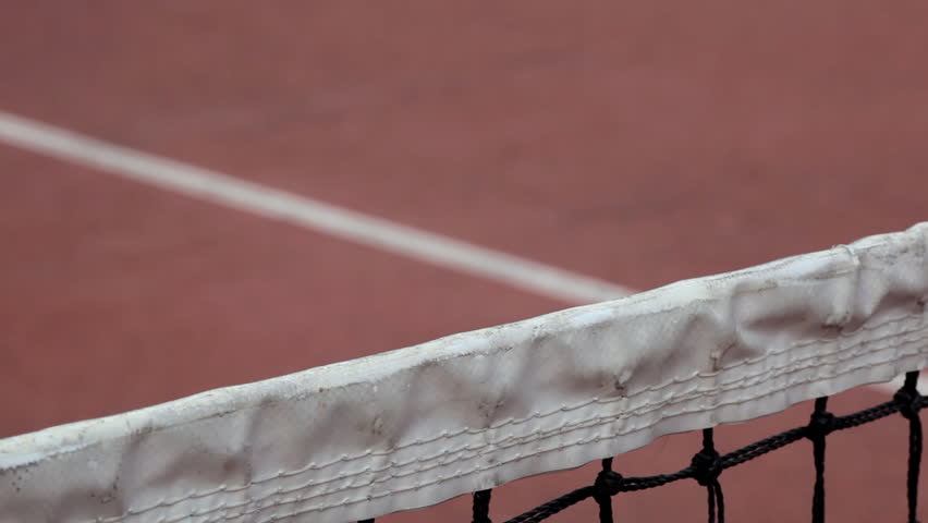 Tennis ball bouncing of the tennis net (slow motion HD clip, created with Canon EOS 5D mark II)
