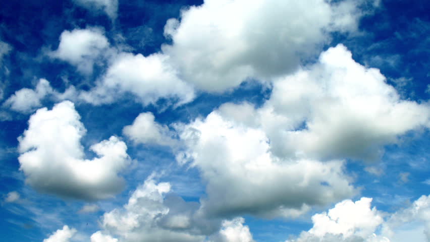Time lapse clip of white clouds over blue sky